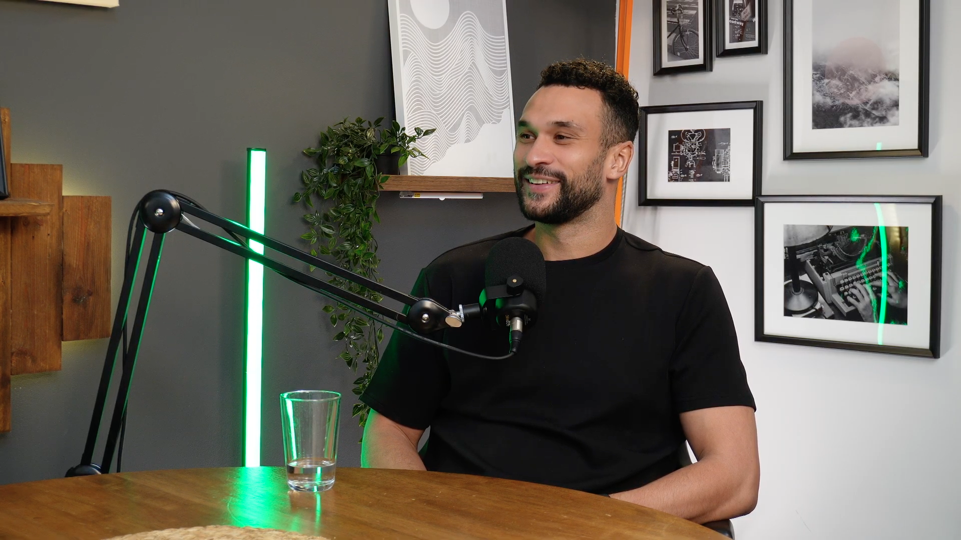 Guest at microphone with green lighting